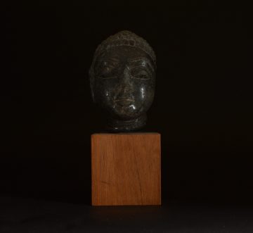 Carved buddha head in basalt Carved buddha head in basalt