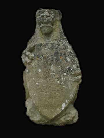 An English carved heraldic lion An English carved heraldic lion